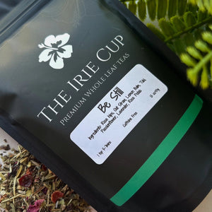 Tea packaging with 'The Irie Cup' branding and a label on a leafy background